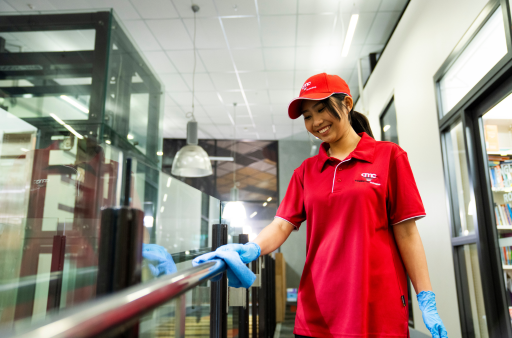Professional cleaner in uniform attending a Large Commercial Office Space in Dallas
