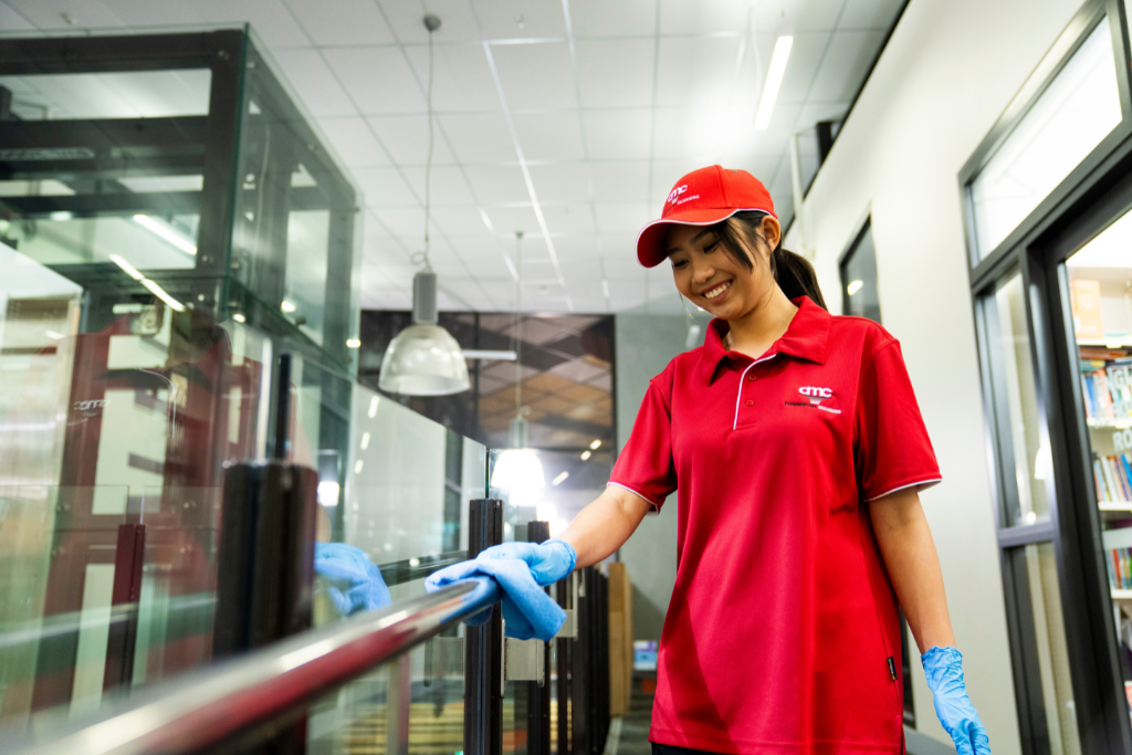 Professional cleaner in uniform attending a Large Commercial Office Space in Dallas